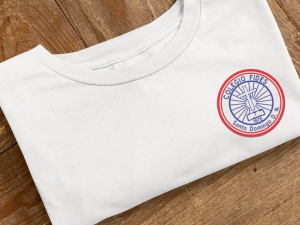 embroidered bella canvas tee mockup featuring a wooden surface m33004 (1)